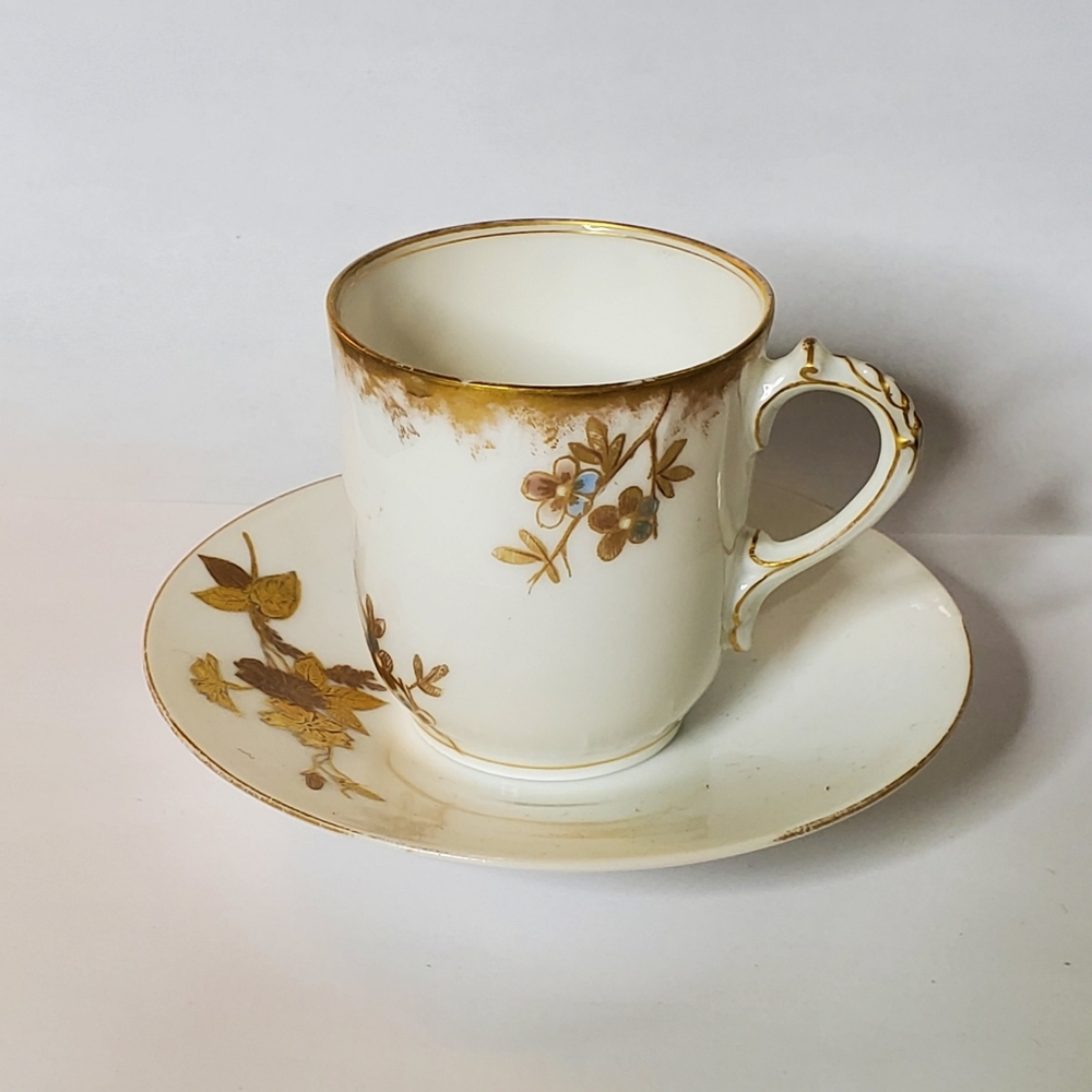 Vintage Cream and gold painted small cup and saucer Marked CFN/CDM In Great cond